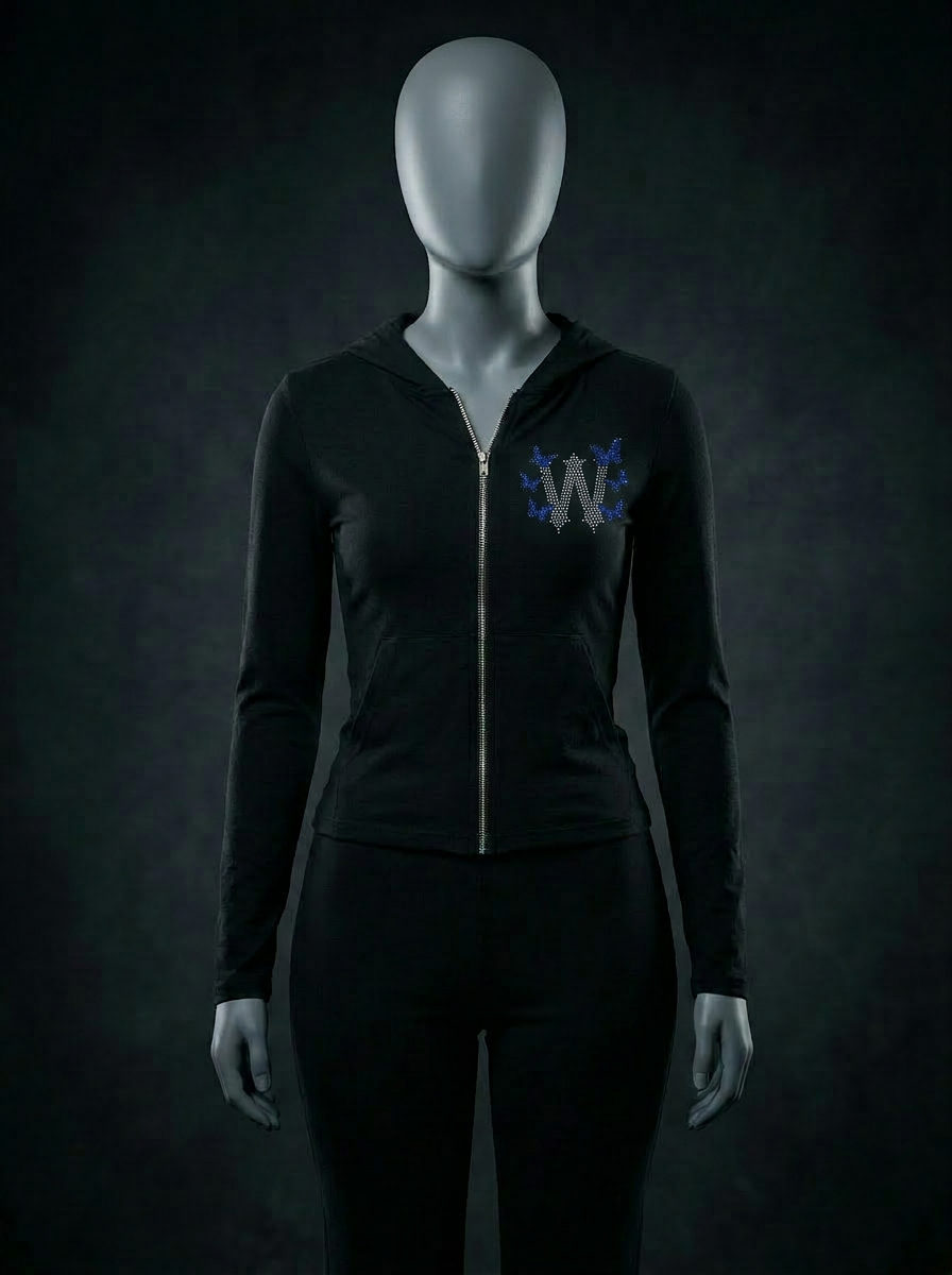 Mannequin wearing black women's zip-up tracksuit with deep sea blue rhinestone butterfly design